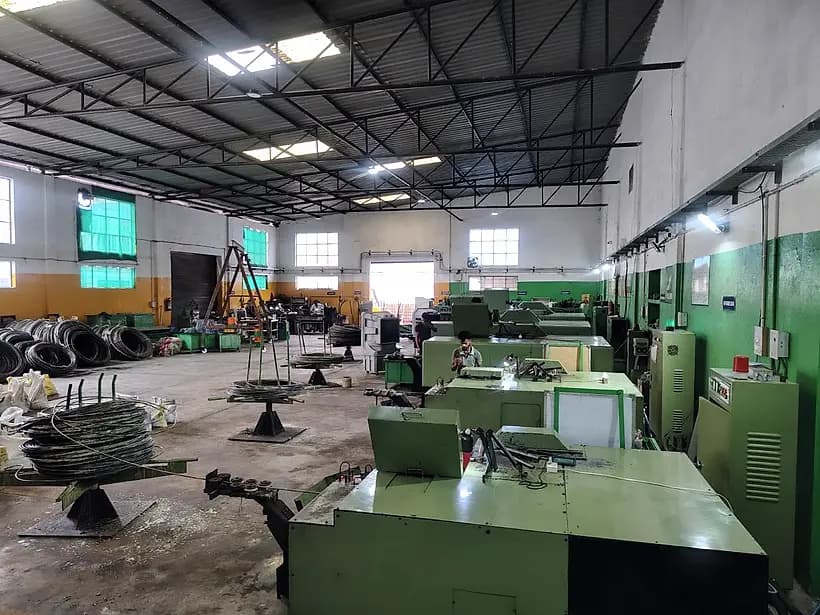 The forging shop, wire rod pay-off stands and nut formers
